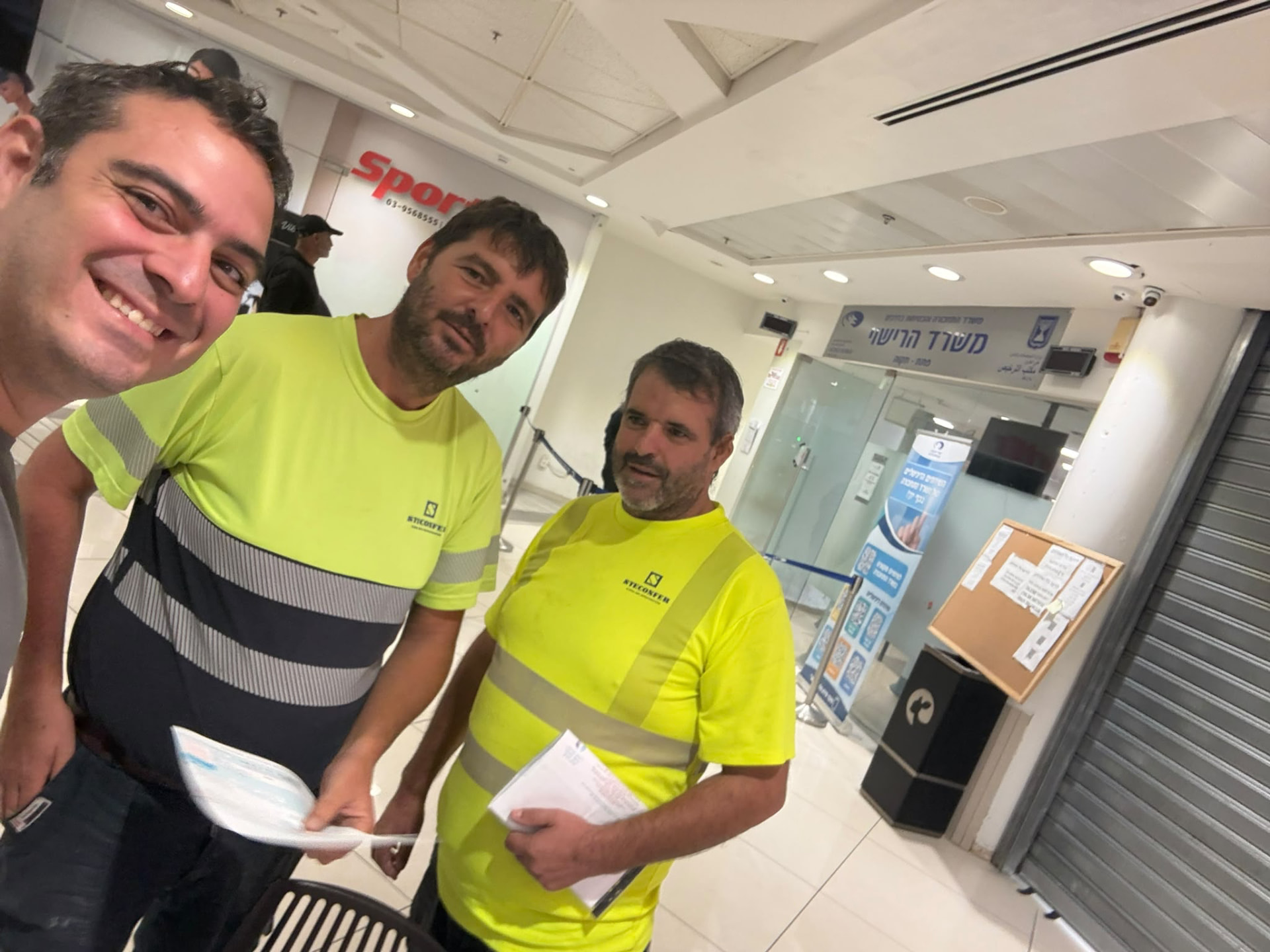 Employees with work licenses in hand